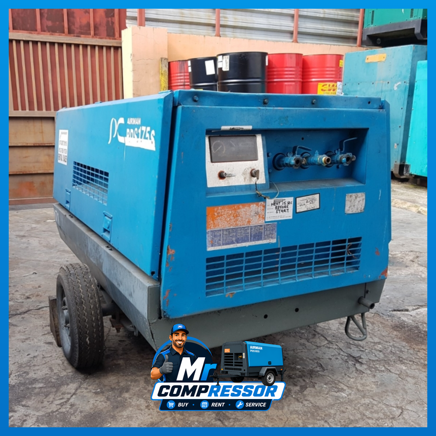 Airman diesel compressor powering pneumatic tools on a job site